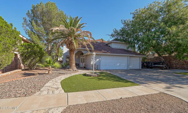 a living room with furniture a rug and a large window