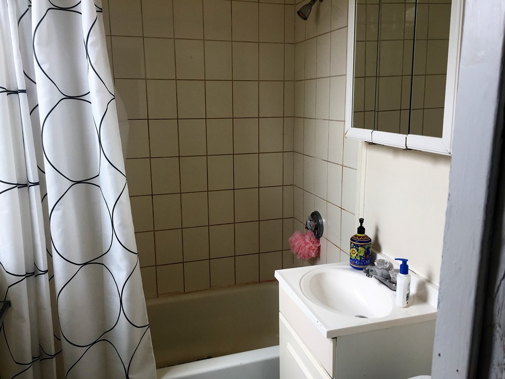 24 Ransom Road, Unit 9 Boston, MA 02135 - Photo 4 of 4 a bathroom with a sink and a mirror
