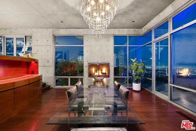 a bed room with furniture and a flat screen tv