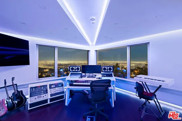 a living room with a couch and a potted plant