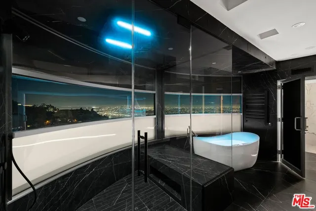 a view of a chairs and table in the patio