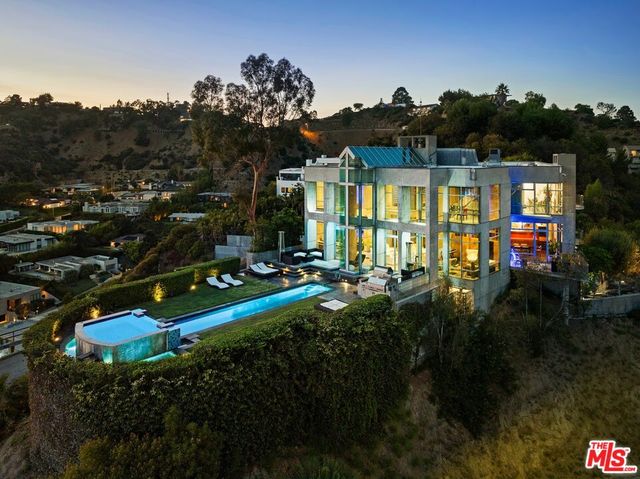 an aerial view of a house with a ocean view