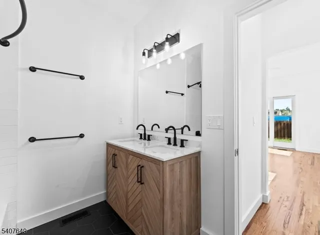 a bathroom with a sink and a mirror
