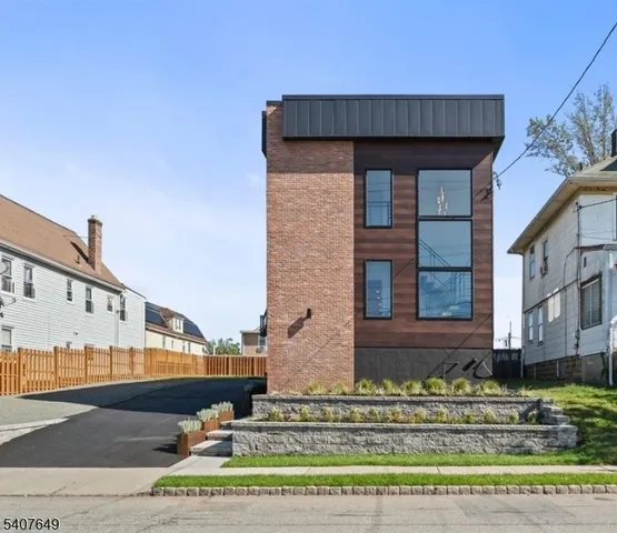 a view of a brick building with large windows