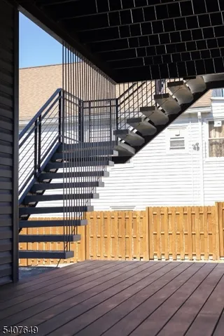 a view of balcony with wooden floor