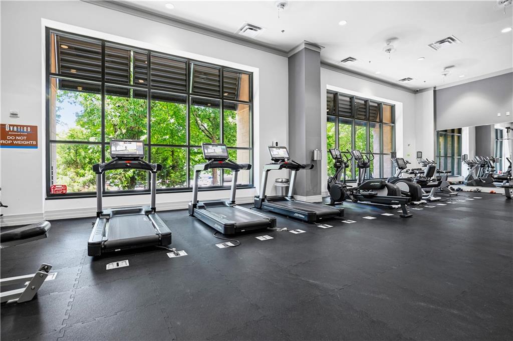 3040 Peachtree Road Northwest, Unit 1503 Atlanta, GA 30305 - Photo 29 of 38 a room with gym equipment and large window