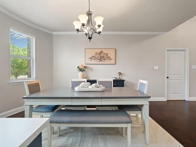 a view of a dining room with furniture and window