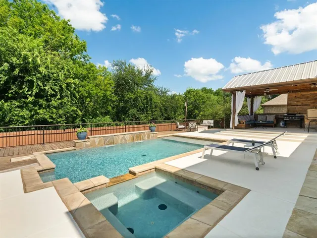 a view of a backyard with a patio