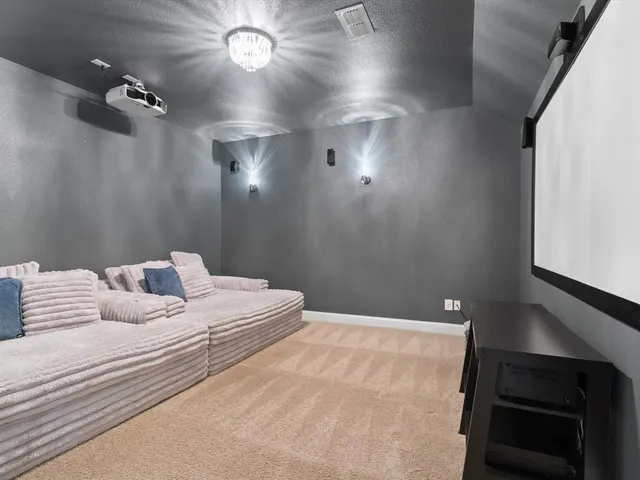 a bedroom with a bed and a night stand