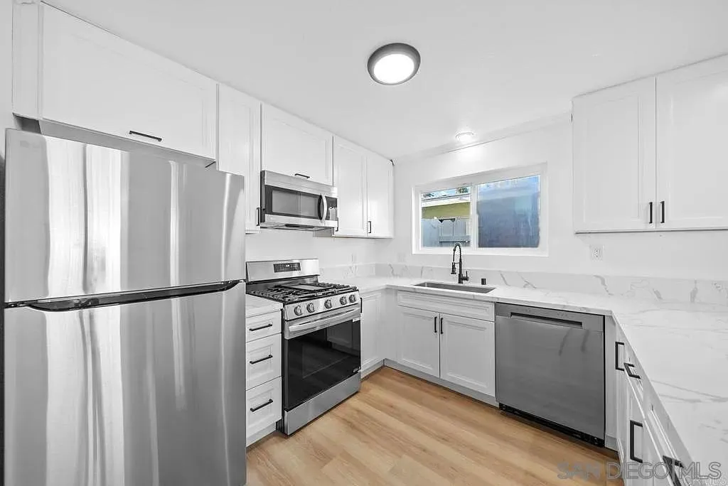 378 7th Street Imperial Beach, CA 91932 - Photo 2 of 41 a kitchen with a sink appliances cabinets and a counter top space