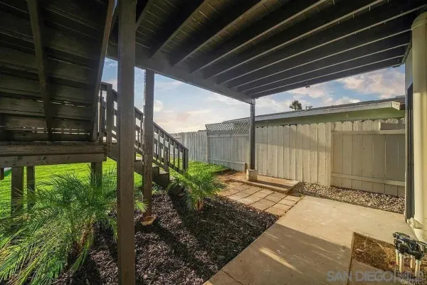 a view of a backyard of the house