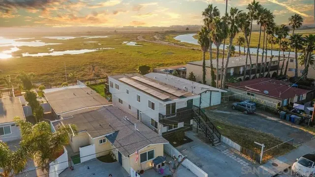 a view of a terrace with lawn chairs