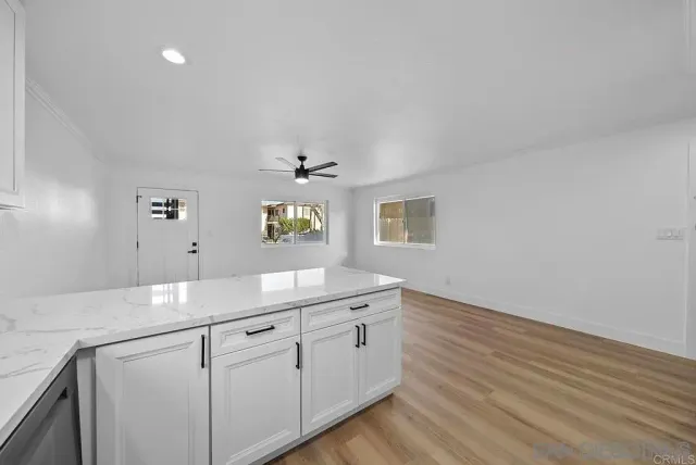a kitchen with a sink and cabinets
