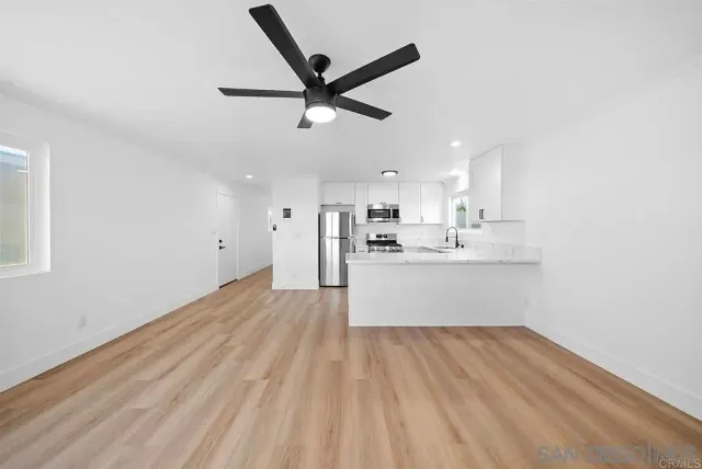 a view of cabinets and wooden floor