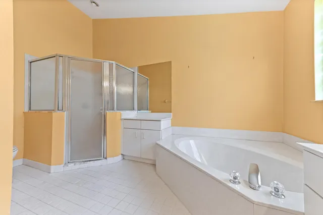a bathroom with a bathtub and a sink