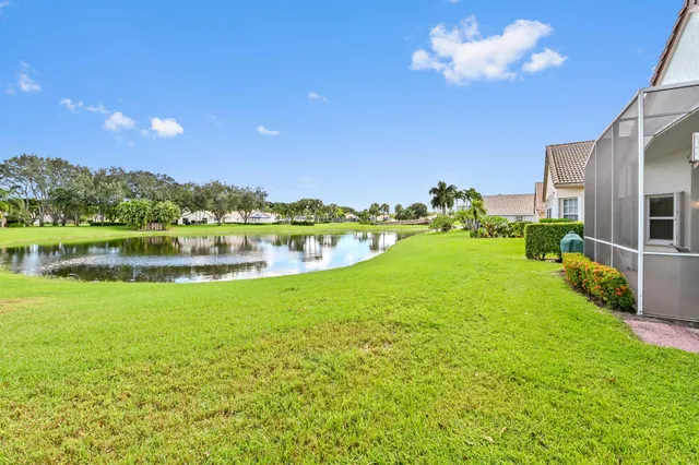 a view of a lake with houses in the background