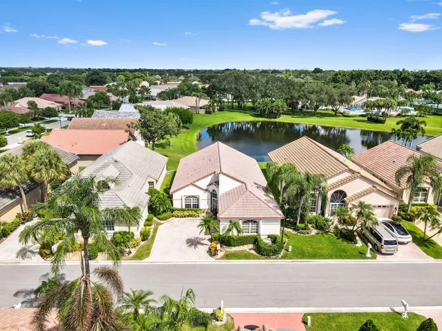 an aerial view of residential houses with outdoor space and street view