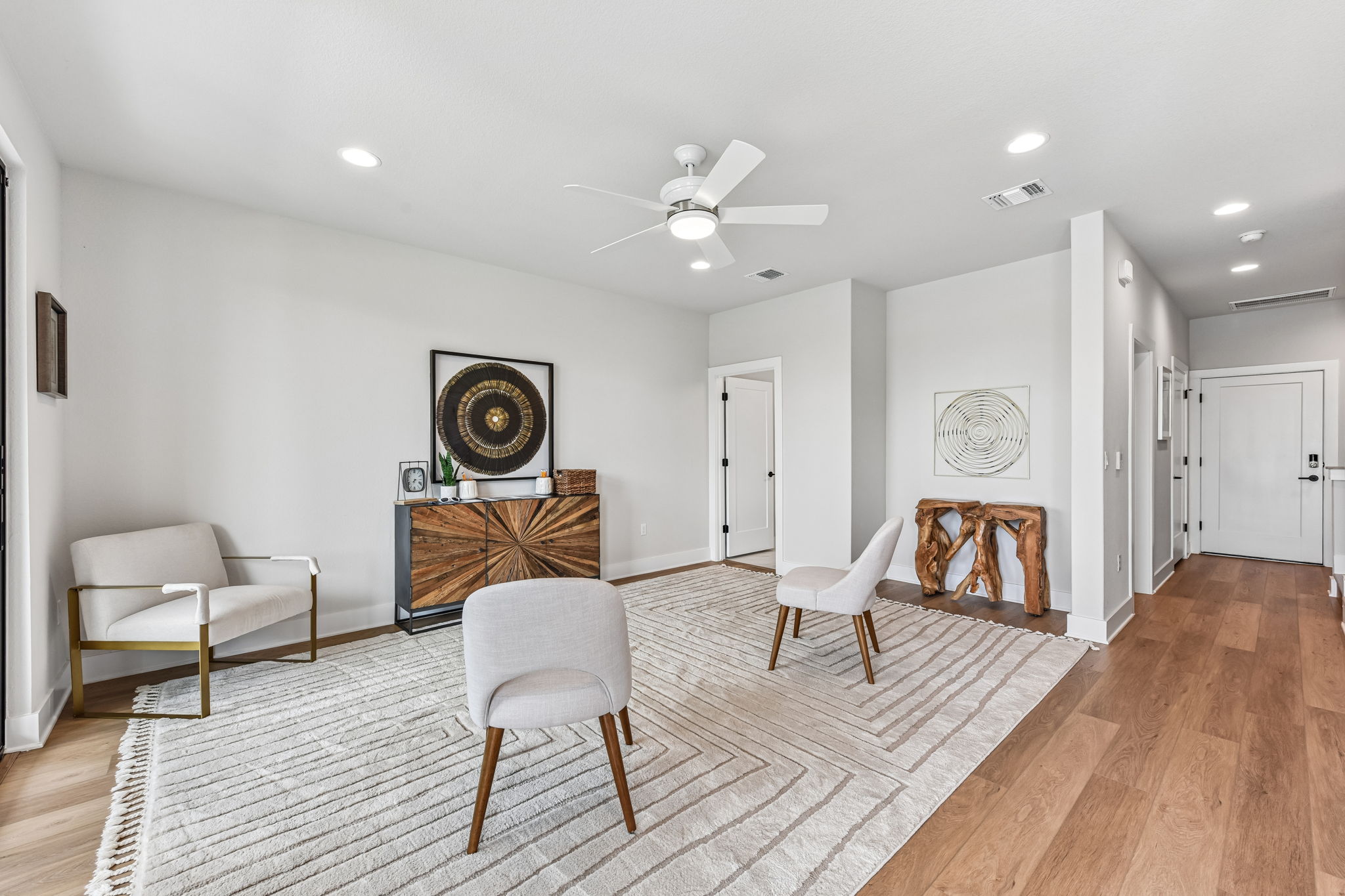 9101 Cattle Baron Path Austin, TX 78747 - Photo 7 of 40 An inviting gathering area with a decorative rug, offering a comfortable and stylized living experience.