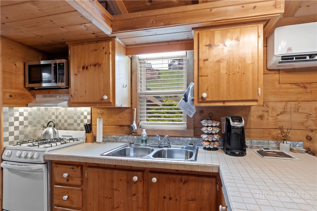 489 Buttons Lane Sparta, NC 28675 - Photo 8 of 30 a kitchen with a sink and a refrigerator