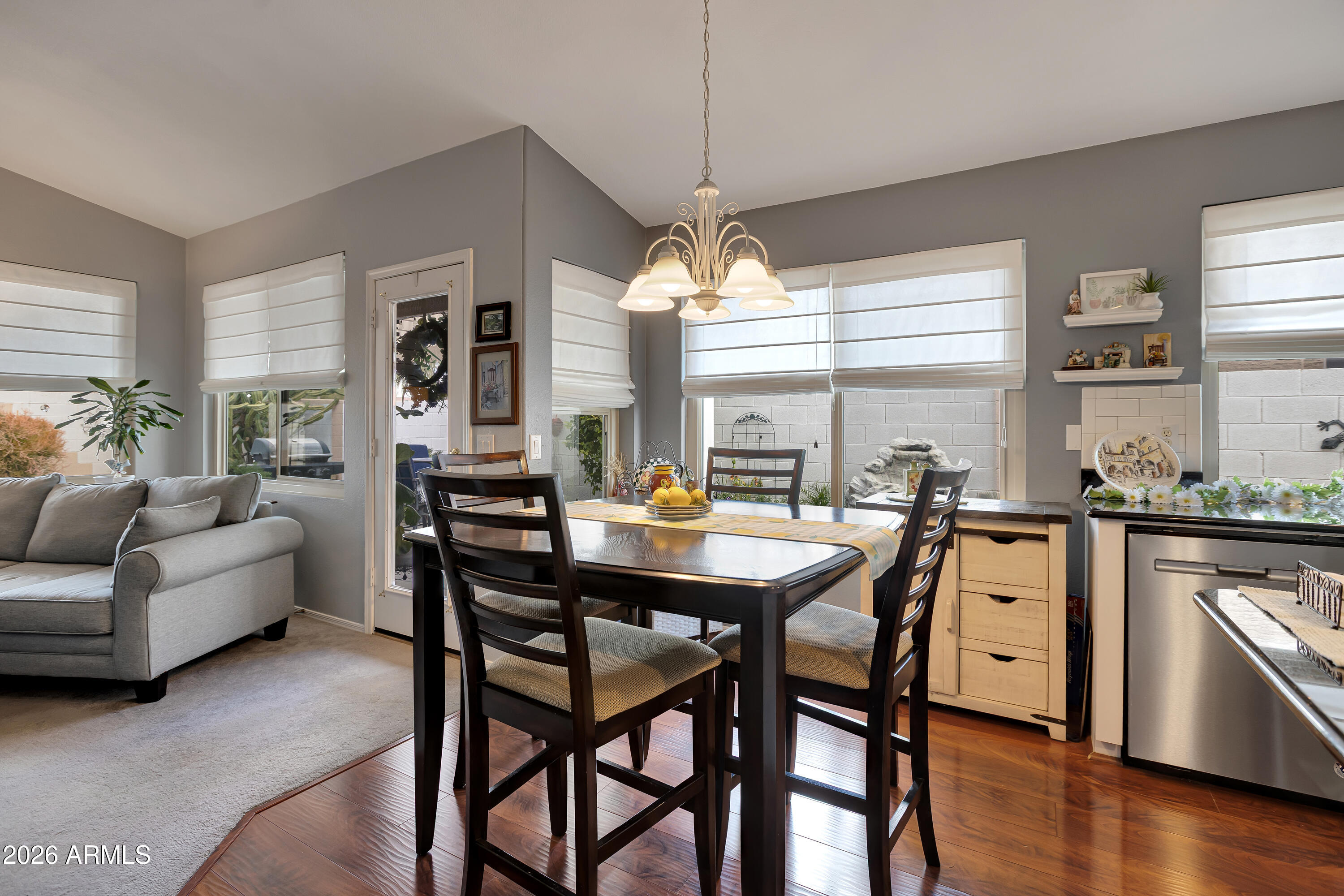 558 East Devon Drive Gilbert, AZ 85296 - Photo 12 of 42 a view of a dining room with furniture and wooden floor