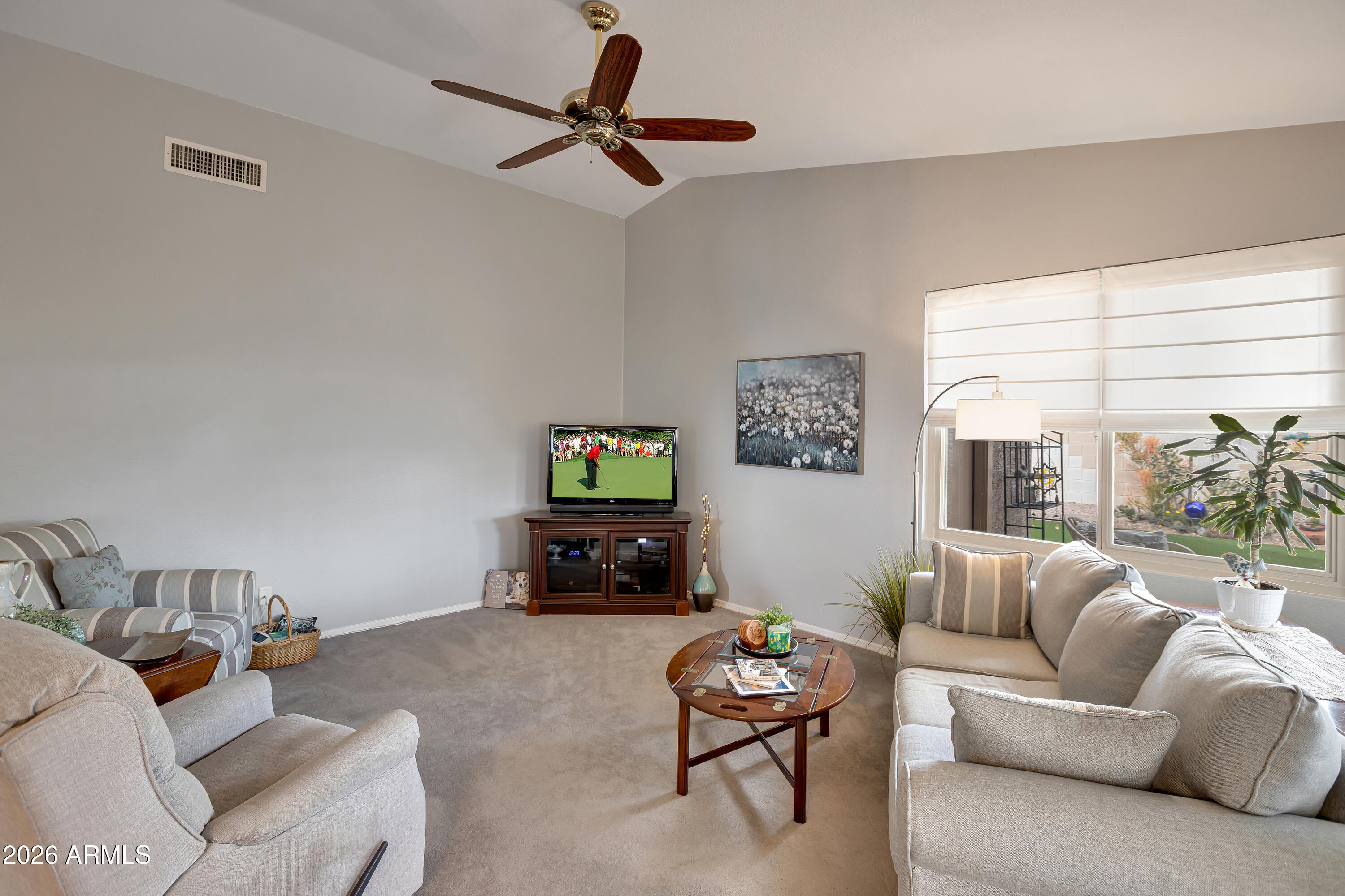 558 East Devon Drive Gilbert, AZ 85296 - Photo 16 of 42 a living room with furniture and a flat screen tv