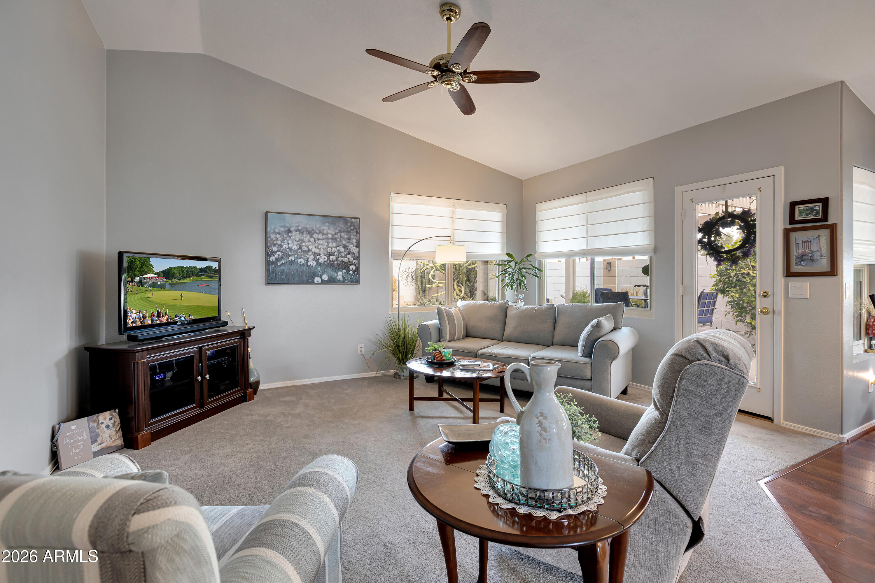 558 East Devon Drive Gilbert, AZ 85296 - Photo 17 of 42 a living room with furniture a flat screen tv and a large window