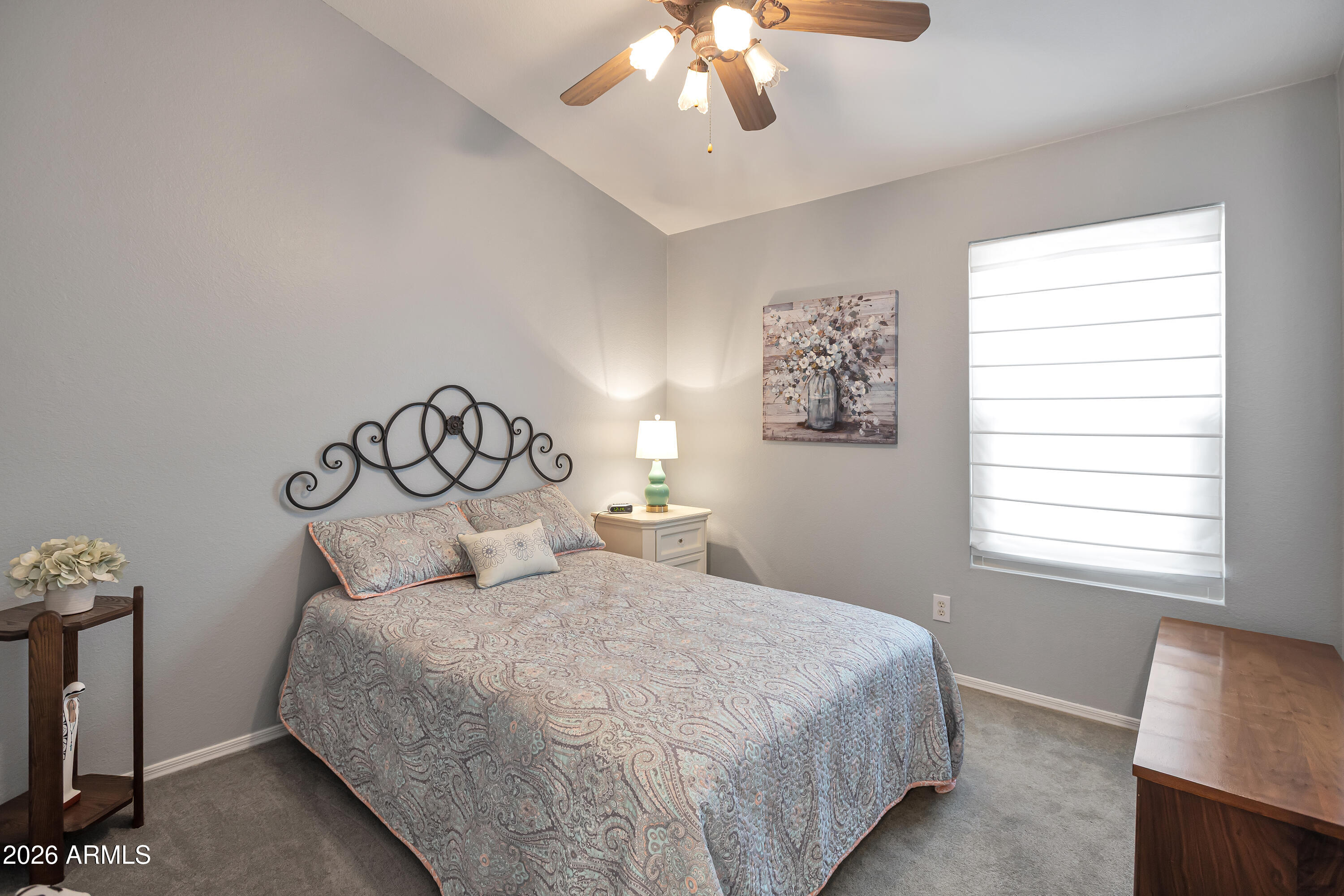 558 East Devon Drive Gilbert, AZ 85296 - Photo 22 of 42 a bedroom with a large bed and a tv