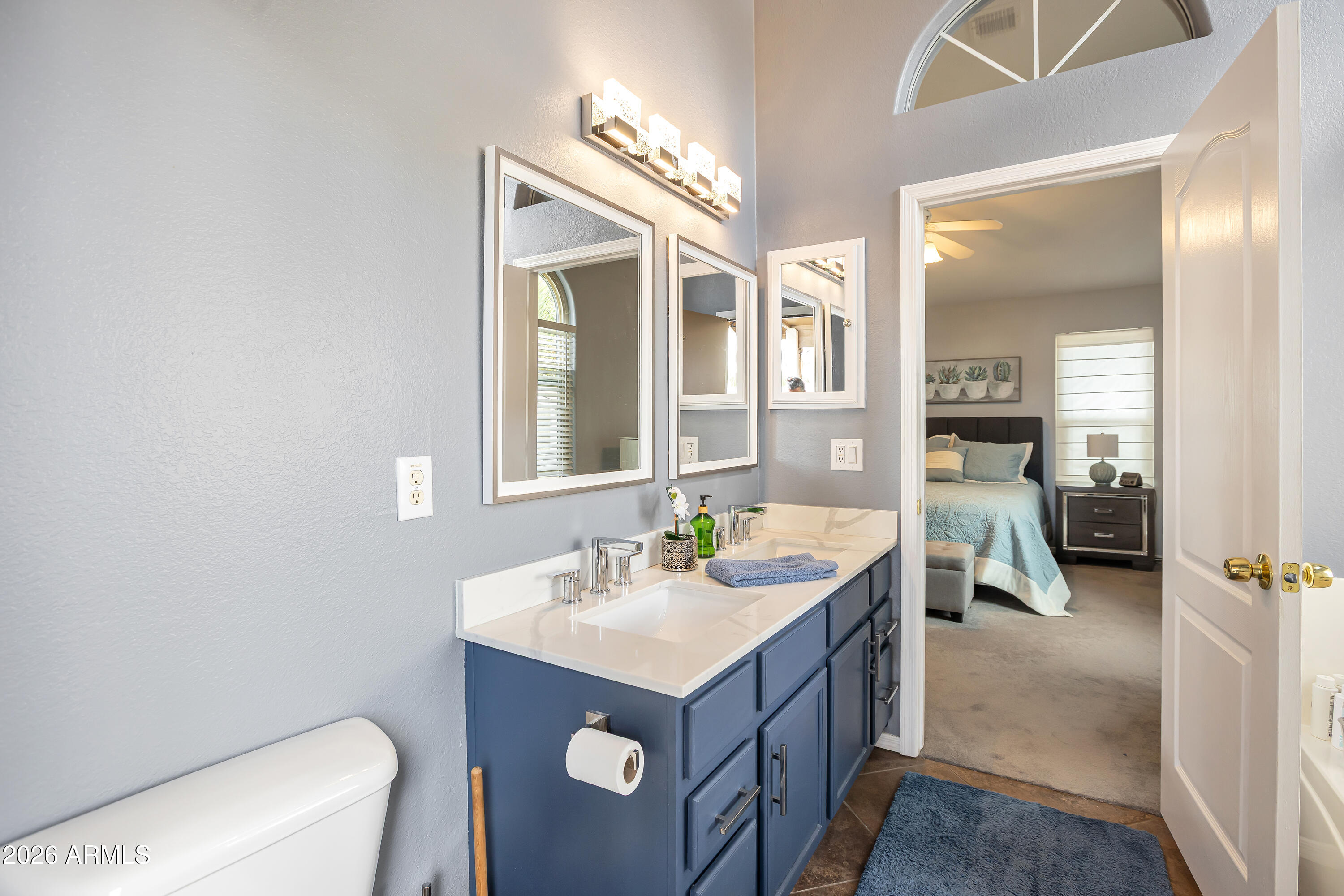 558 East Devon Drive Gilbert, AZ 85296 - Photo 28 of 42 a bathroom with a sink and mirror