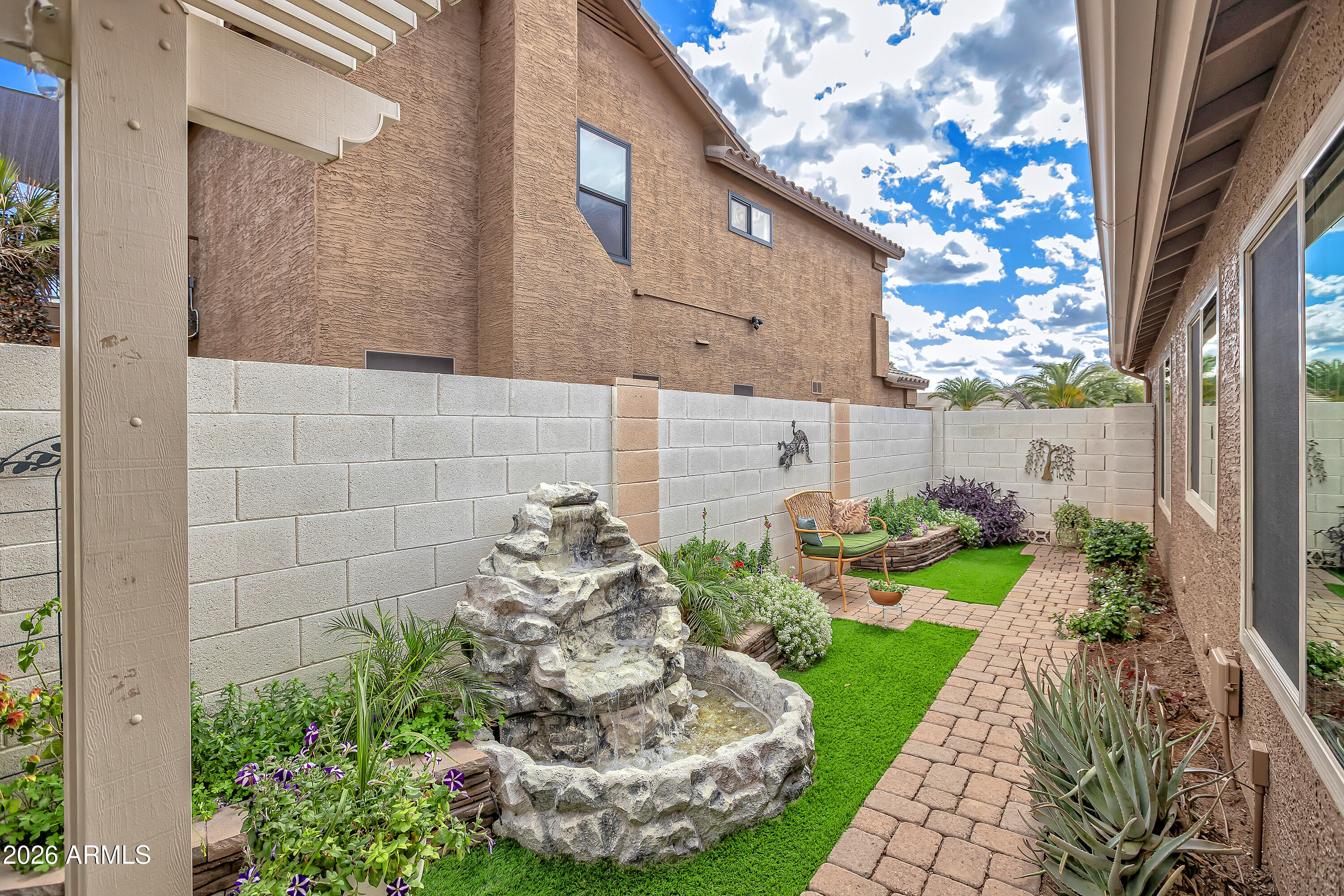 558 East Devon Drive Gilbert, AZ 85296 - Photo 30 of 42 a view of a backyard with potted plants