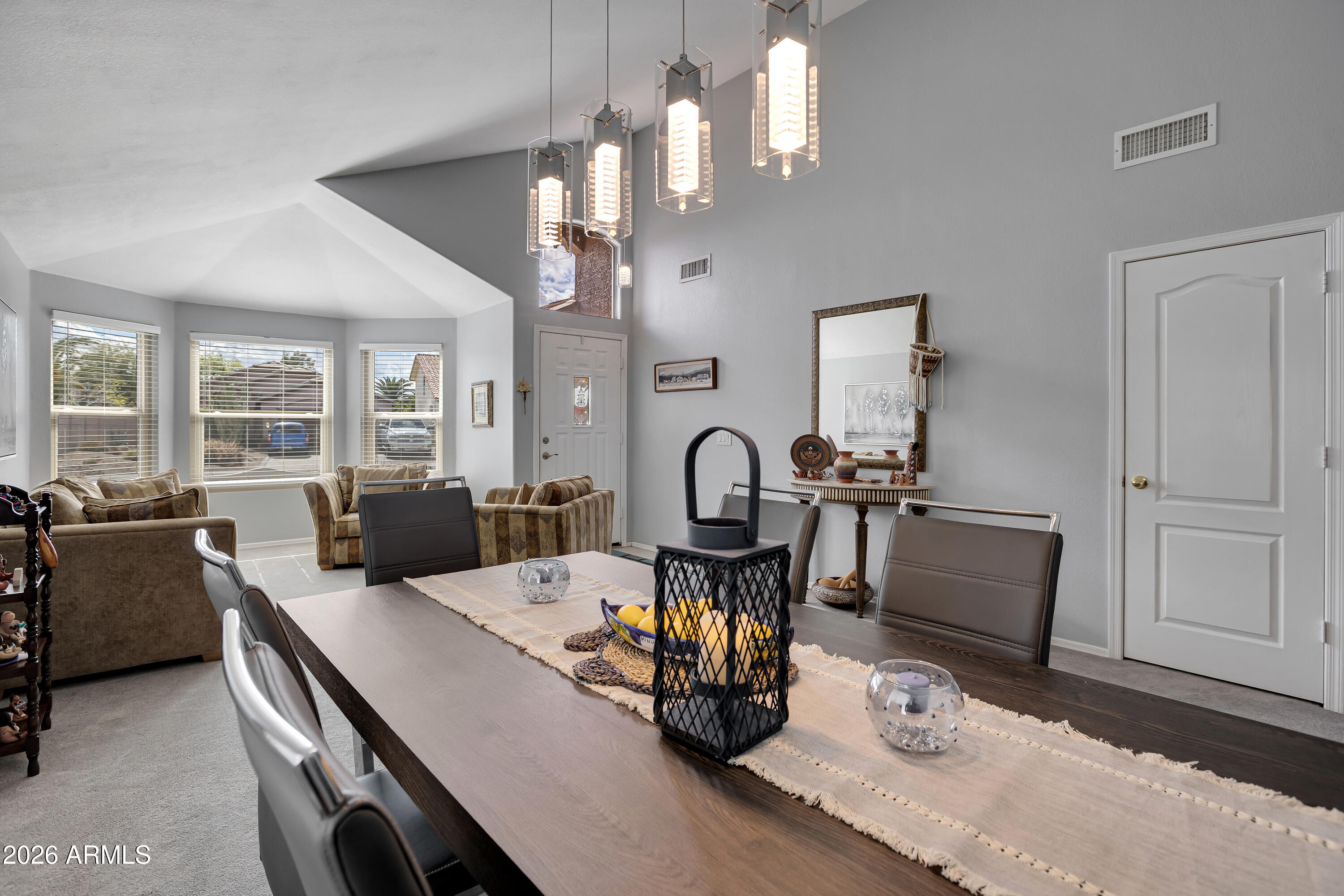 558 East Devon Drive Gilbert, AZ 85296 - Photo 3 of 42 a view of a dining room with furniture and chandelier