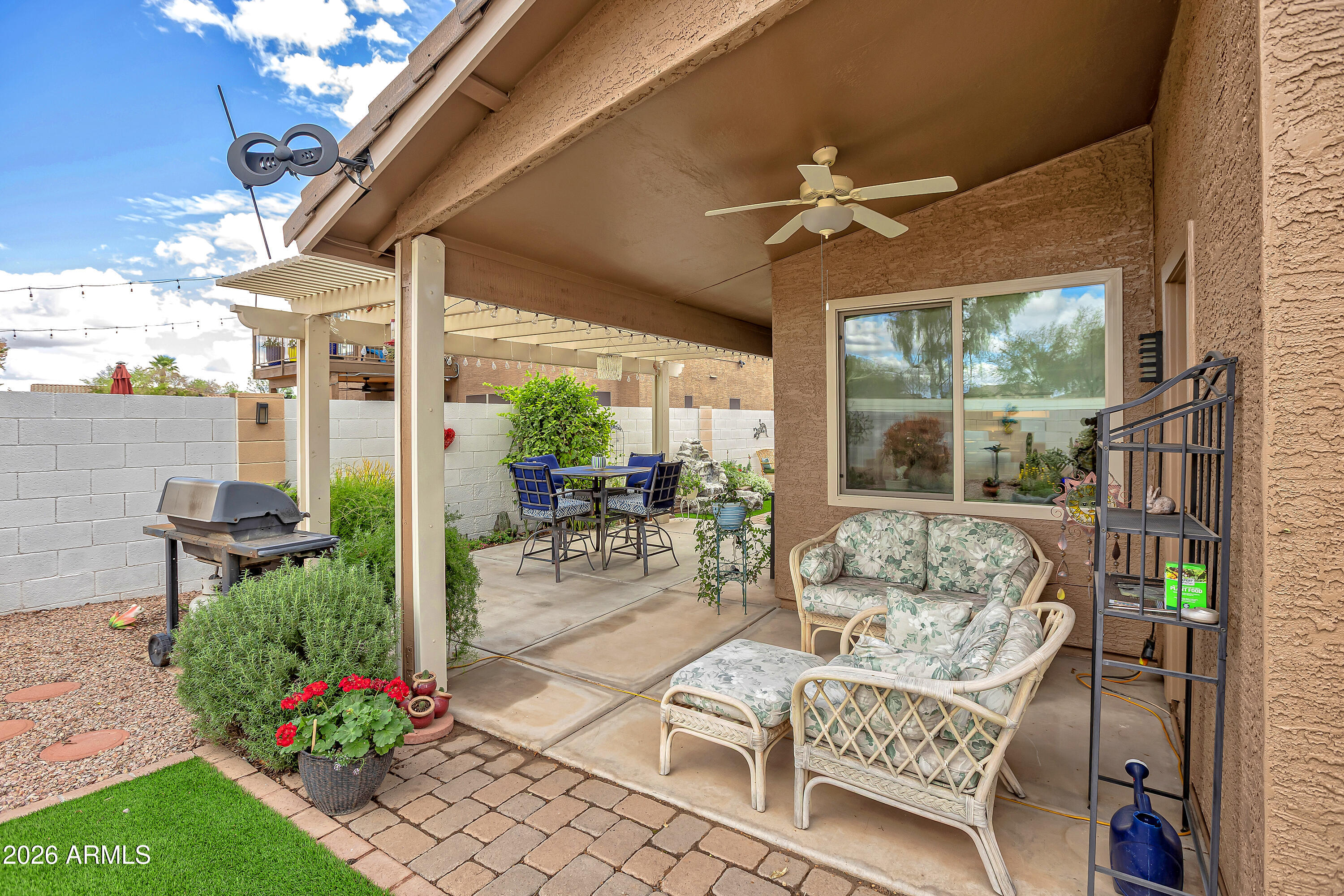 558 East Devon Drive Gilbert, AZ 85296 - Photo 34 of 42 a patio with yard table and chairs