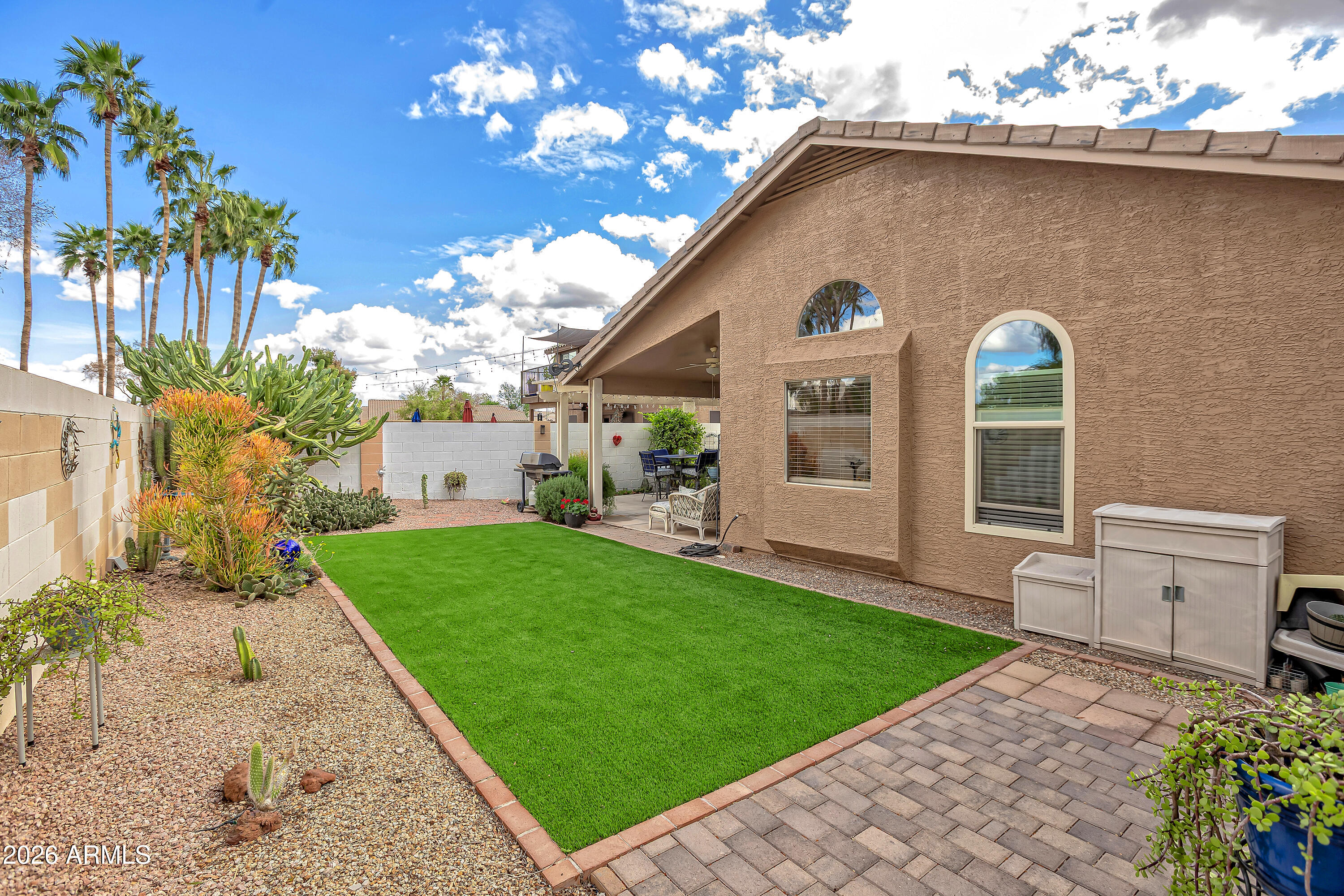 558 East Devon Drive Gilbert, AZ 85296 - Photo 35 of 42 a front view of a house with a yard