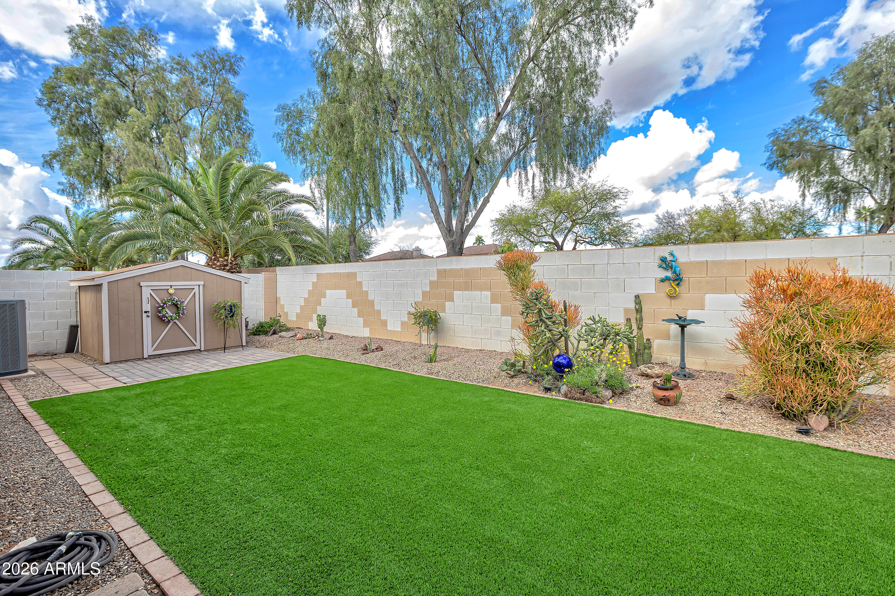 558 East Devon Drive Gilbert, AZ 85296 - Photo 36 of 42 a view of a house with a yard and a tree
