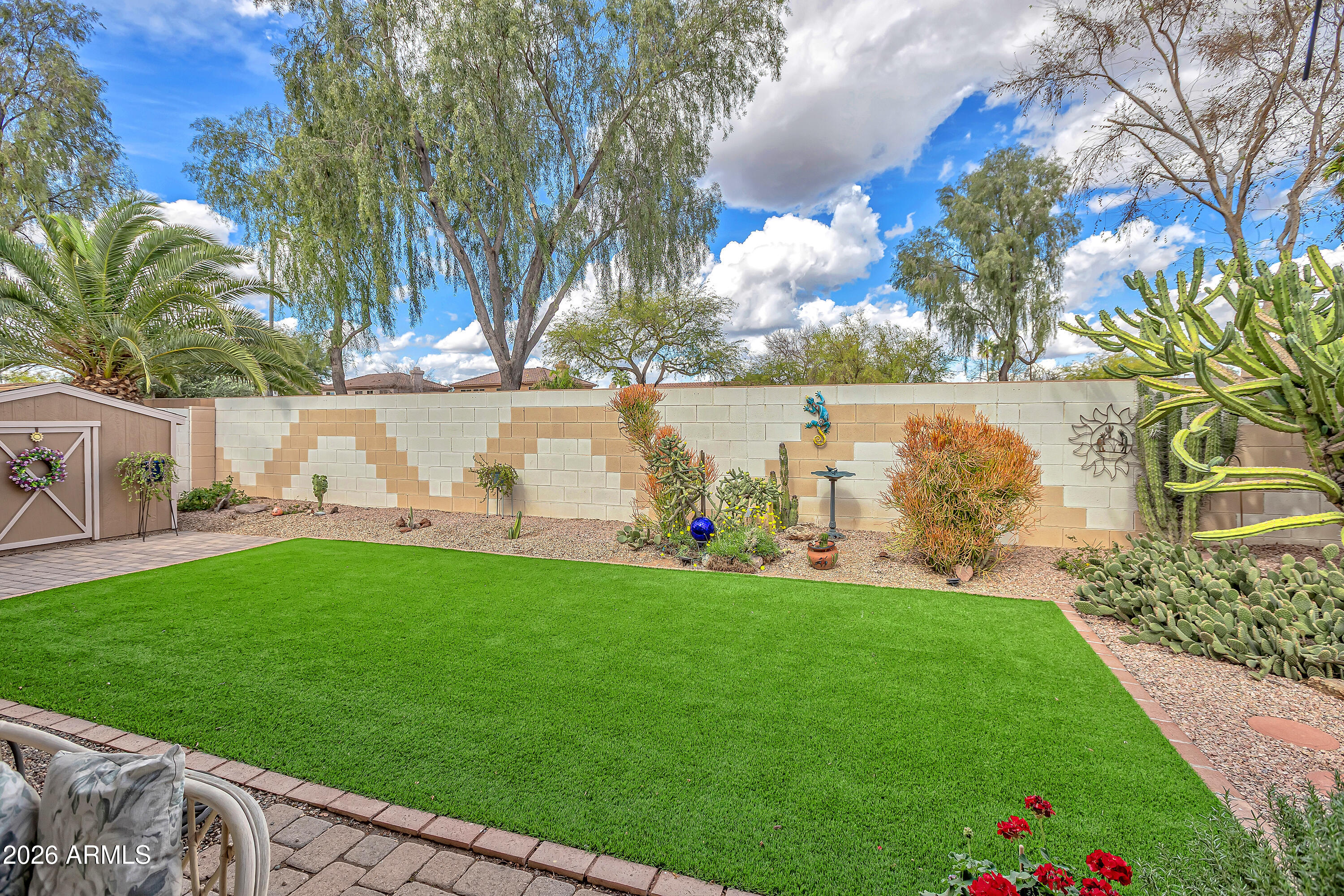 558 East Devon Drive Gilbert, AZ 85296 - Photo 38 of 42 a view of yard with swimming pool and seating