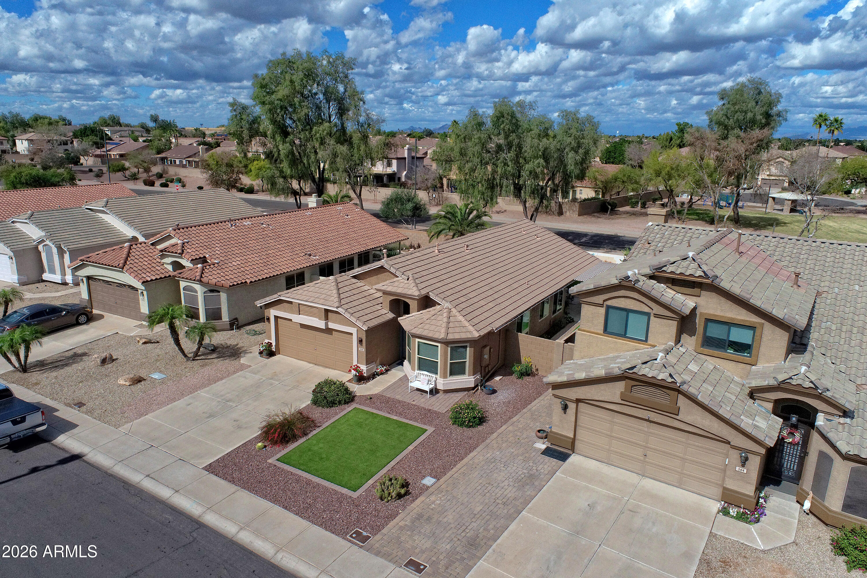 558 East Devon Drive Gilbert, AZ 85296 - Photo 40 of 42 an aerial view of multiple houses with yard