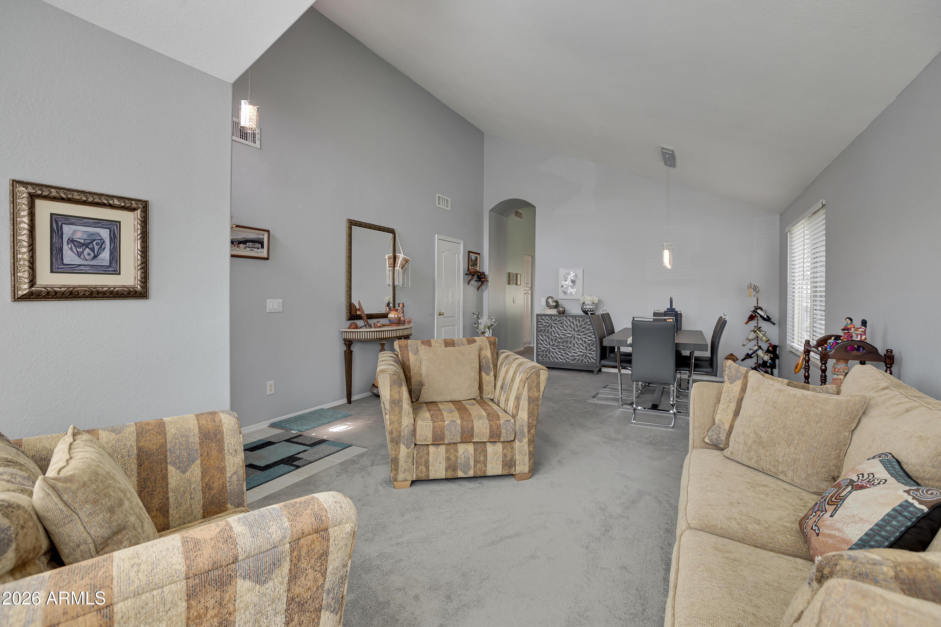 558 East Devon Drive Gilbert, AZ 85296 - Photo 6 of 42 a living room with furniture and a couch