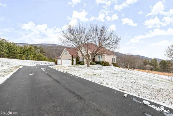 a living room with furniture fireplace and flat screen tv