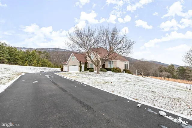 a living room with furniture fireplace and flat screen tv