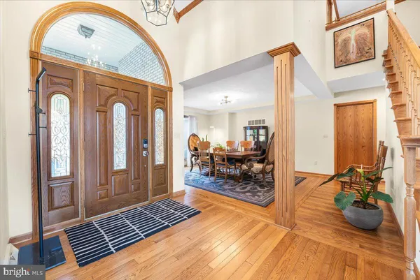 a living room with furniture fireplace and a large window