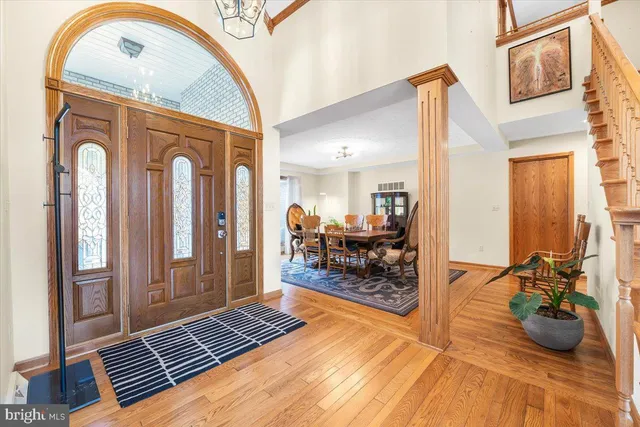 a living room with furniture fireplace and a large window