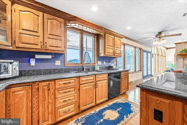 a bedroom with a large bed and a large window