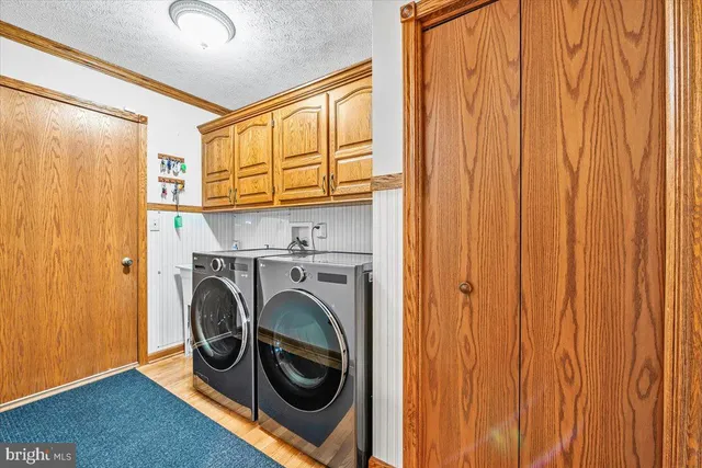 a white toilet sitting next to a bath tub