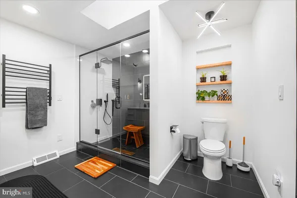 a view of a balcony with wooden floor and fence