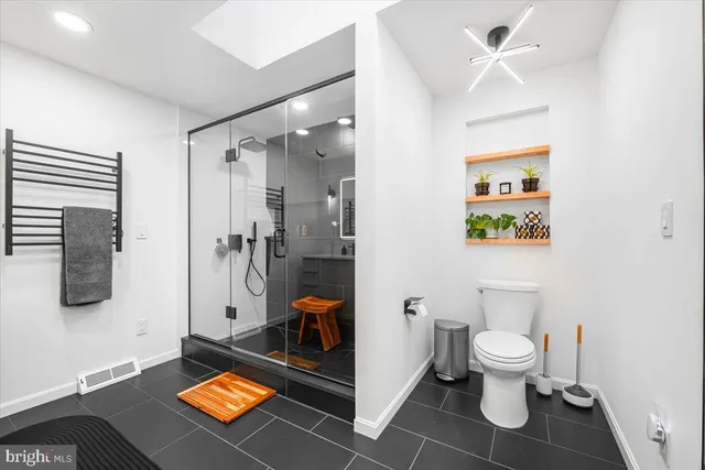 a view of a balcony with wooden floor and fence