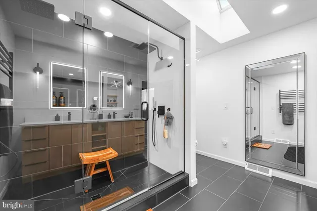 a front view of a house with a yard covered in snow