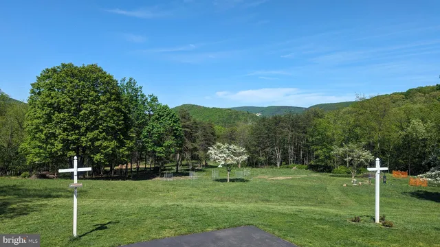 a view of an entryway with wooden floor and door
