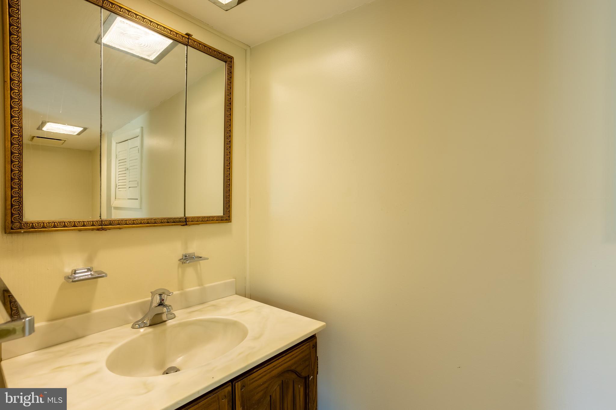 3612 Churchville Road Aberdeen, MD 21001 - Photo 23 of 49 a bathroom with a sink and a mirror