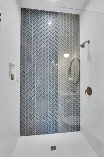 a view of a livingroom with furniture and windows wooden floor and a chandelier
