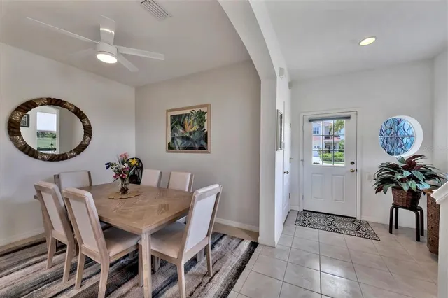 a view of a dining room with furniture and chandelier