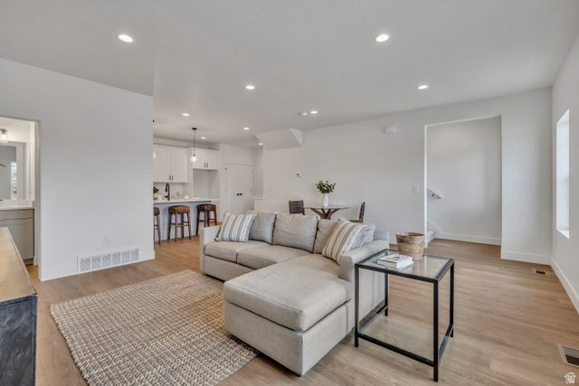 330 East 7635 S Street Sandy, UT 84047 - Photo 10 of 29 Living area featuring light wood-type flooring and recessed lighting
